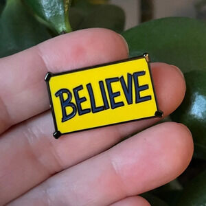 Brand new Ted Lasso inspired “BELIEVE” yellow sign enamel pin